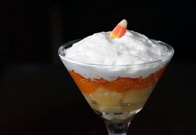 Candy Corn Fruit Martini - a layer of pineapple and mandarin oranges, top with whipped cream and a single candy corn on top.