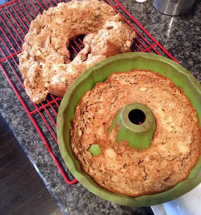 apple spice bundt that fall apart in a red cooling rack