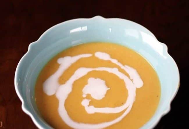 close up of a turquoise soup bowl with Butternut Squash, Lentil & Coconut Curry Soup