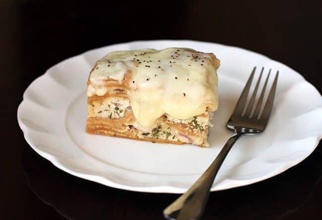 Creamy Chicken Alfredo Crockpot Lasagna in White Plate with Fork