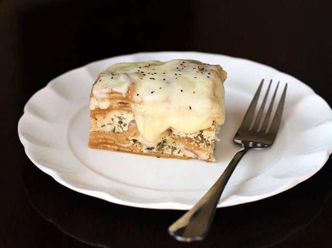 Creamy Chicken Alfredo Crockpot Lasagna in White Plate with Fork