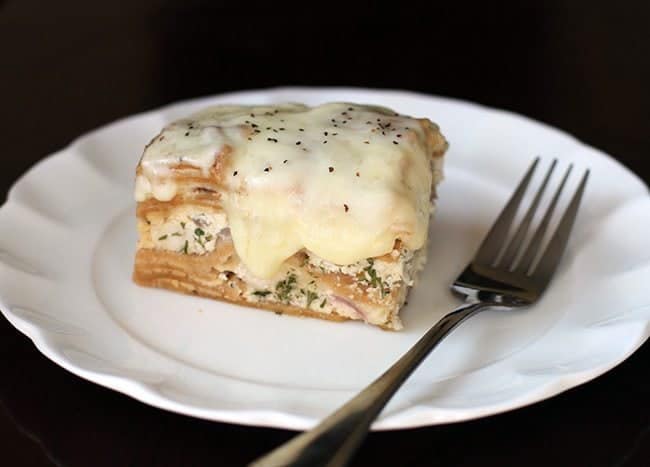 Creamy Chicken Alfredo Crockpot Lasagna in White Plate with Fork