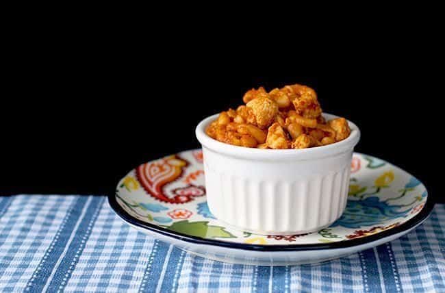 Chicken Tikka Masala Pasta in white ramekins on a colorful small plate