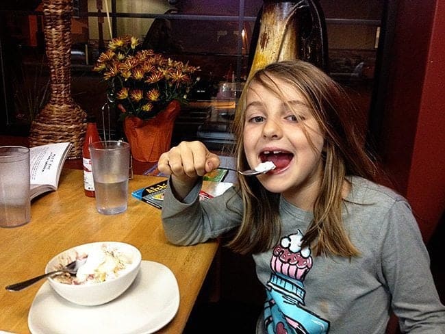 daughter having a plain cheese quesadilla