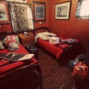 inside a room at Jimmy Robinson's Duck Lodge with two beds