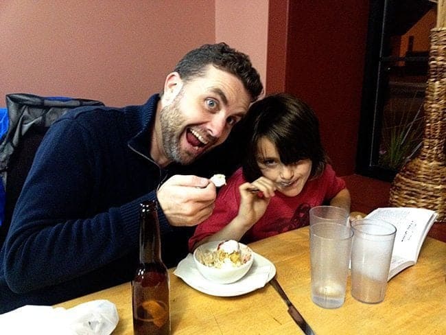 father and son enjoying some fried ice cream