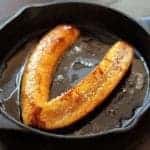 Fried Plantains in skillet with melted butter and sugar