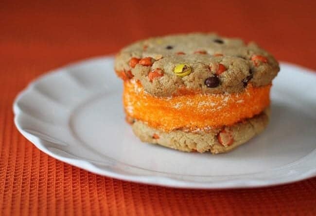 PB Halloween Ice Cream Sandwich Cookies in a middle of white plate in red background