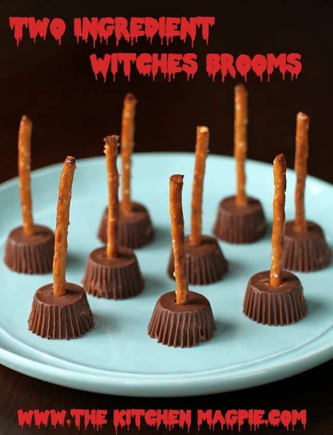 plate with Two Ingredient Witches Brooms - Reese’s miniature Peanut Butter cups with pretzel stick inserted into the middle