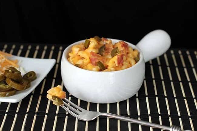Buffalo Hot Sauce,Bacon & Jalapeno Mac and Cheese in a white serving dish