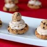Large chocolate chip piped with cream cheese and topped with a small chocolate chip
