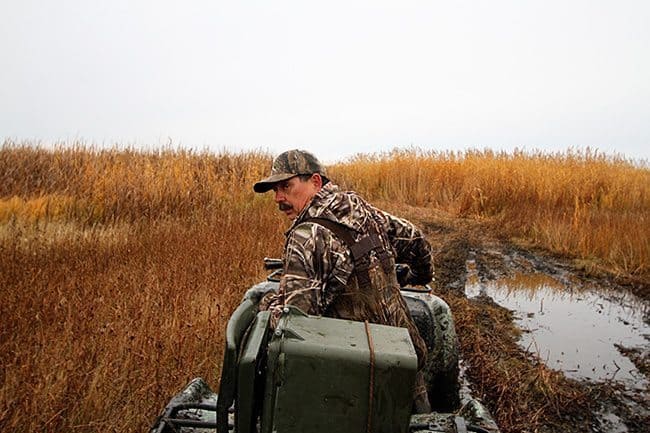 man riding the service going to duck hunting 