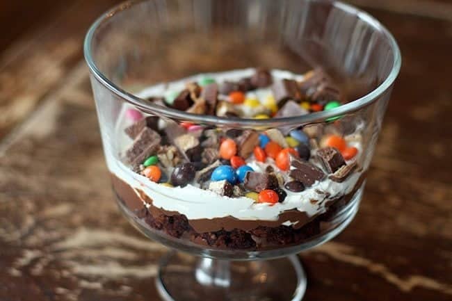 transparent cup with the first layer of Brownie Trifle