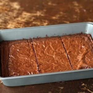 Sliced brownies in a baking pan