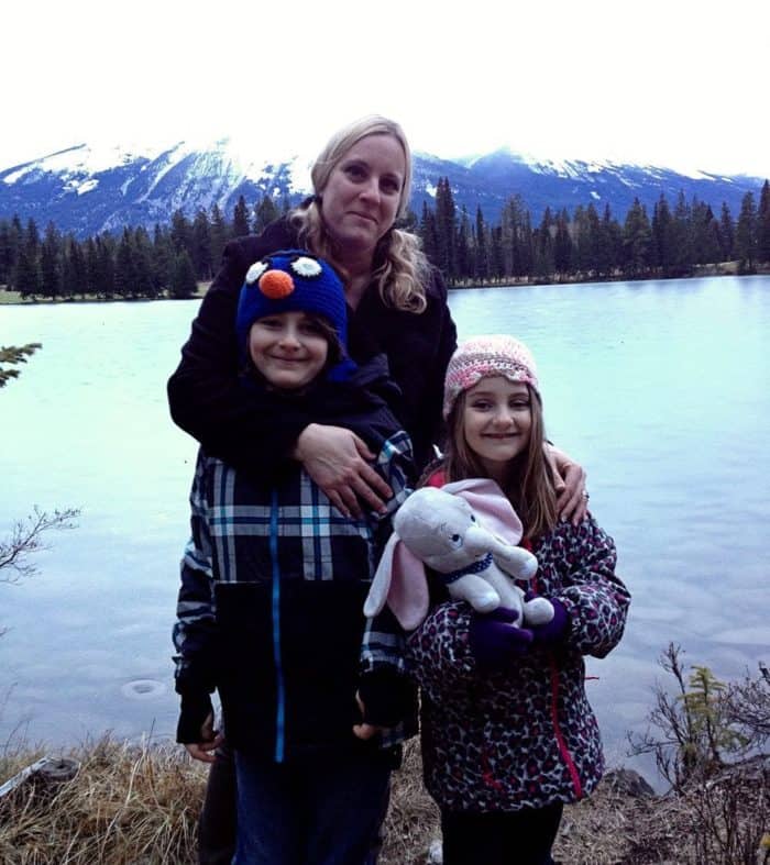 mother with her two children with the view of the lakefront suites