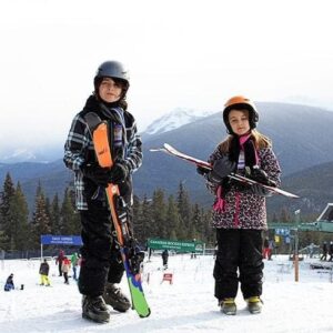 Two kids Skiing At Marmot Basin