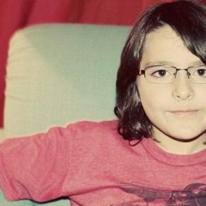 using a camera with flash in taking the photo of young boy
