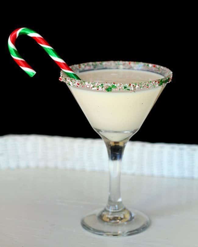 Close up of peppermint eggnog martini with candy crane