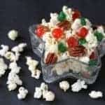 Close up of Christmas Popcorn in with colored cherries and pecans in a Star Shaped Container