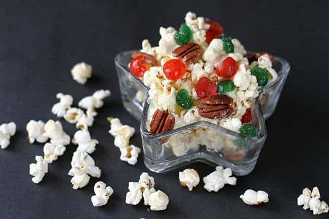 Five Minute Christmas Popcorn in with colored cherries and pecans in a Star Shaped Container