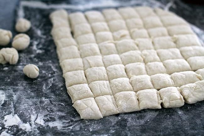 sliced Christmas Monkey Bread dough on a lighly floured work surface