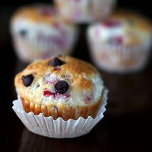 Close up of Chocolate Raspberry Muffins on black background