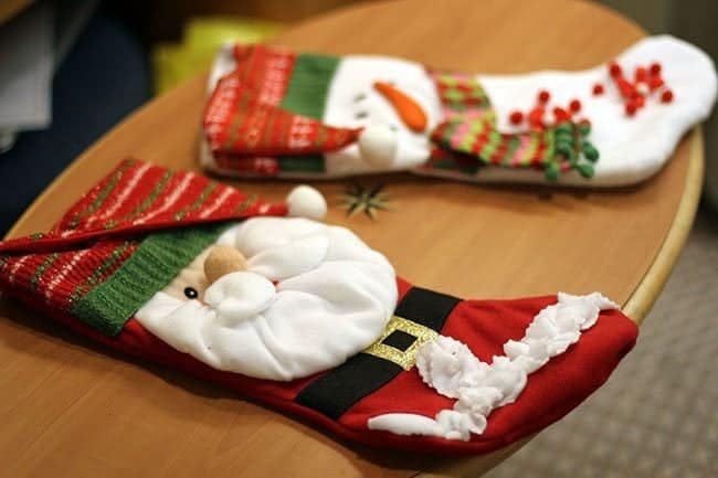 two Santa stockings on top of the table