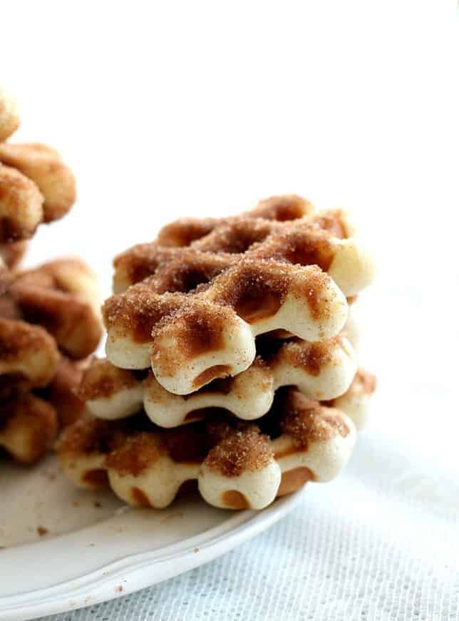 close up stack of Mini Waffle Donuts in white plate