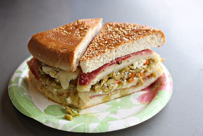 A plate loaded with Muffaletta Sandwich