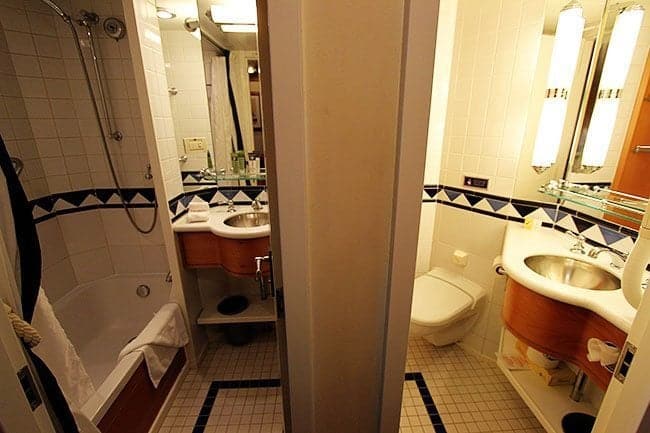 split bathroom, separating the toilet from a shower and sink area