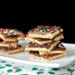 Close up of Saltine Toffee Squares in a White Plate