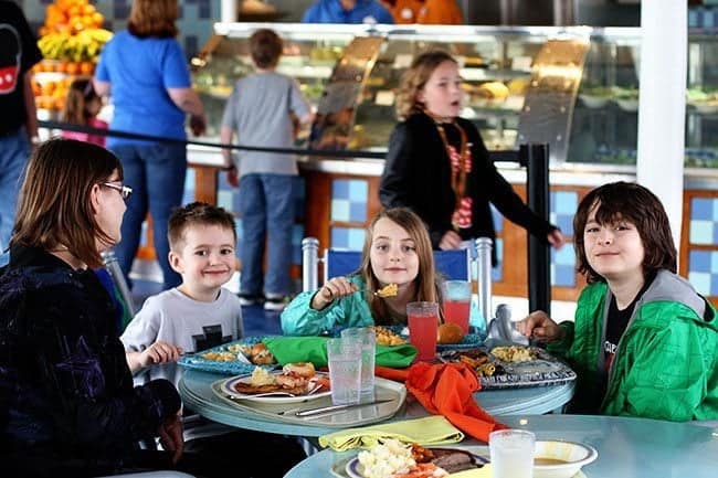 Group picture of a mother and kids in a table enjoying their foods at the Beach Blanket Buffet