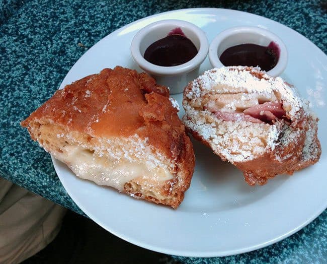 Two slices of Regular Monte Cristo in a white plate 