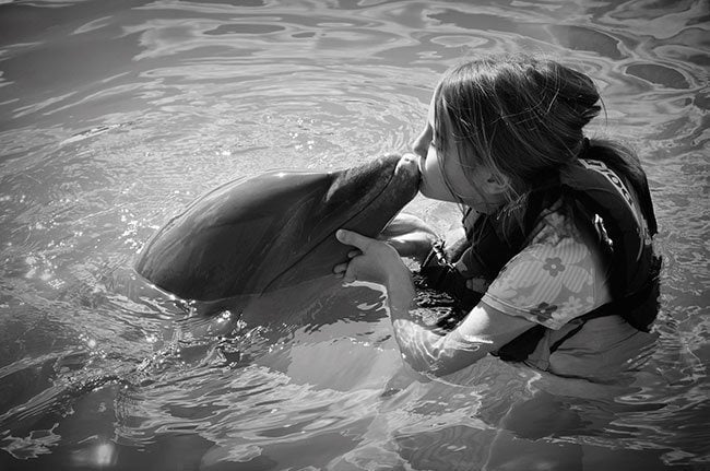 young girl with the dolphin kiss