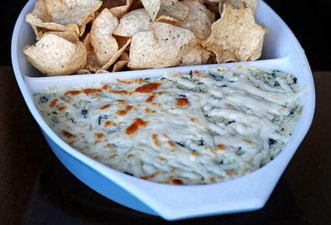 close up of Chips with Cheesy Kale & Artichoke Dip in a Pyrex Bowl