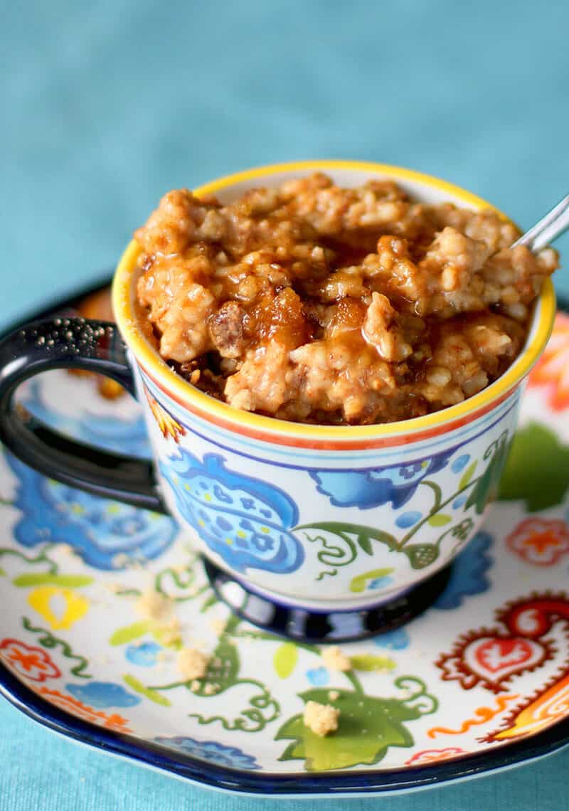 Cinnamon Raisin Slow Cooker Oatmeal topped with maple syrup