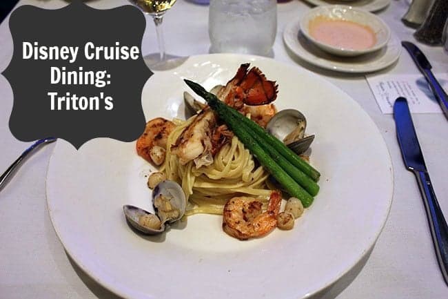 Disney Wonder Dining - white plate with seafood pasta with a lobster tail, scallops, mussels and shrimp