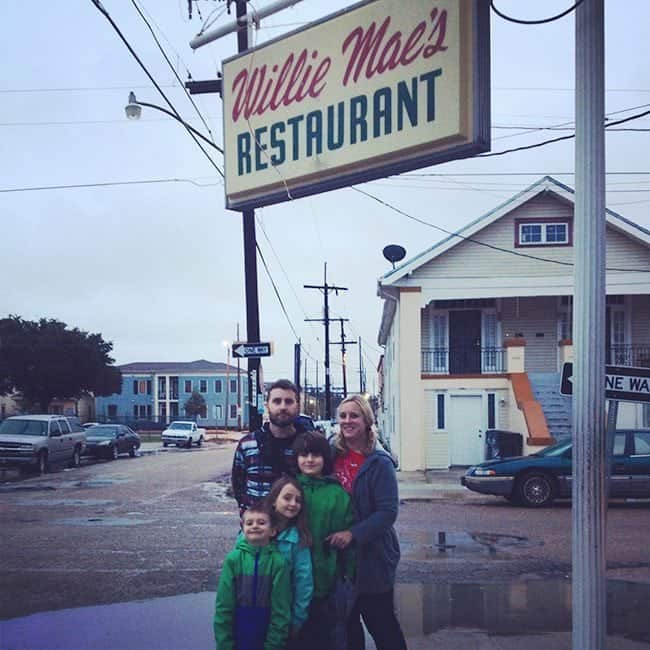 group picture with Willy Mae's Restaurant signage