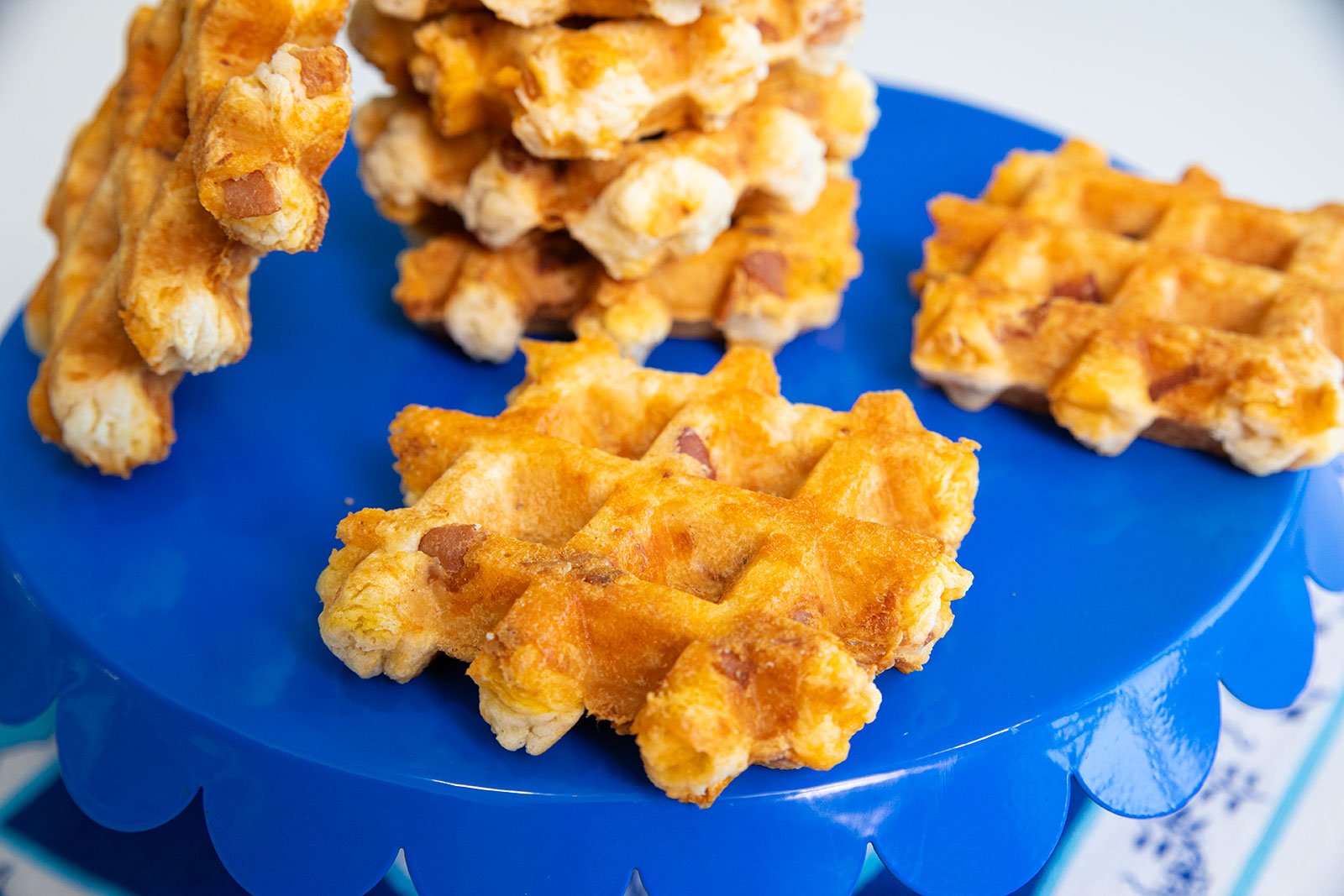 Savory biscuits with crispy bacon and melted cheddar, cooked in a waffle iron.