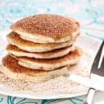 Snickerdoodle Pancakes coated with sugar and cinnamon mixture in a white plate