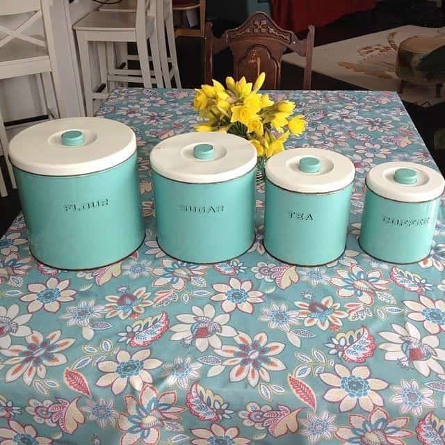 a set of turquoise kitchen canisters