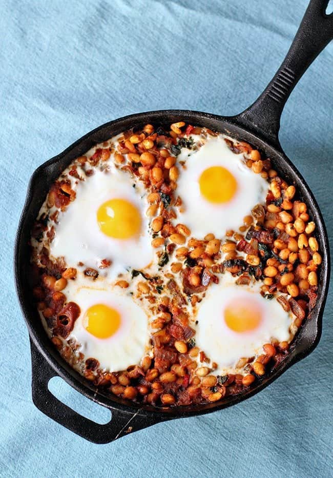 Curried White Bean & Kale Skillet with Four Eggs