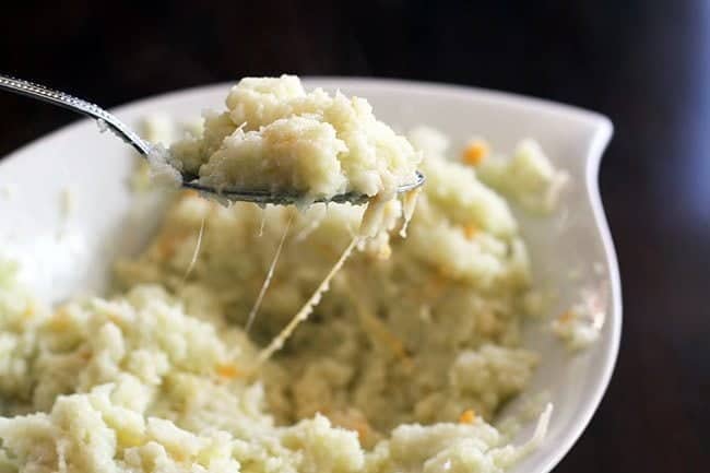 A spoon of Mashed Cauliflower with cheese melting