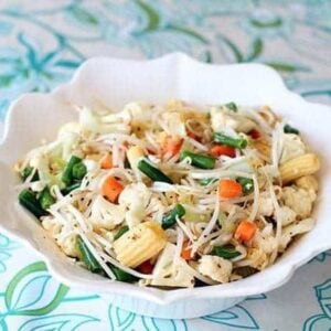 close up Marinated Vegetable Salad in a white ruffle bowl