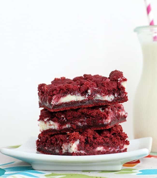 Close up of Cream Cheese Filled Red Velvet Cake Bars in a White Square Plate
