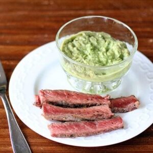 BBQ Steak & Horseradish Guacamole in a white plate with fork on the side