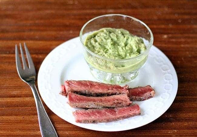 BBQ Steak & Horseradish Guacamole in a white plate with fork on the side