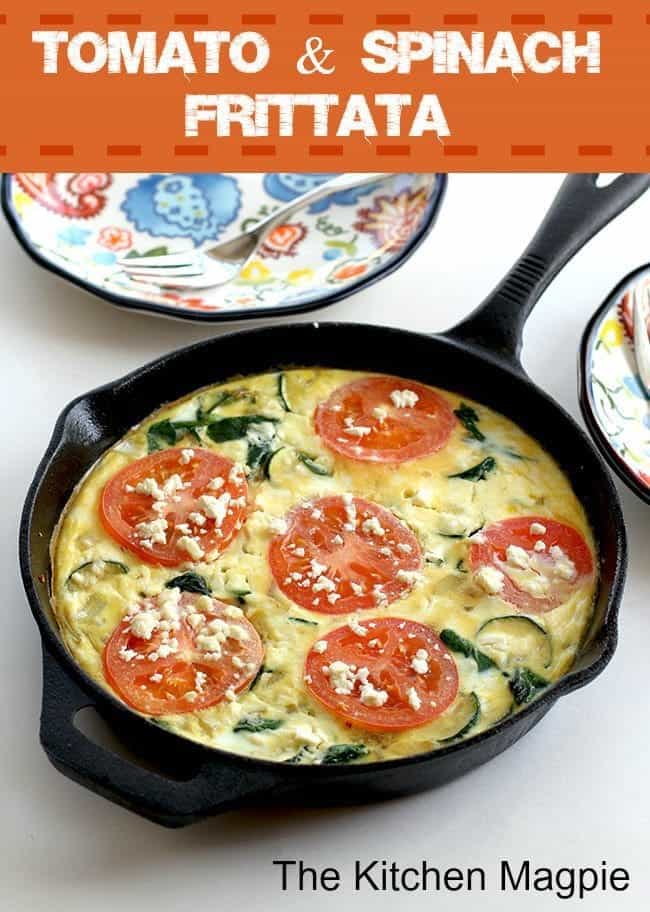 Tomato, Spinach & Feta Frittata in a black skillet