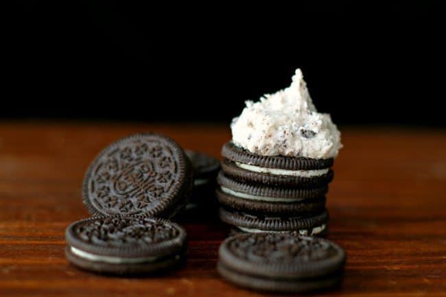 Stack of Oreo cookies with Cookies n' Cream Buttercream Frosting on Top