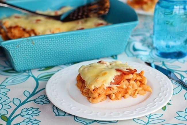 Pepperoni Pizza Mac N'Cheese in a white plate and in the blue baking pan